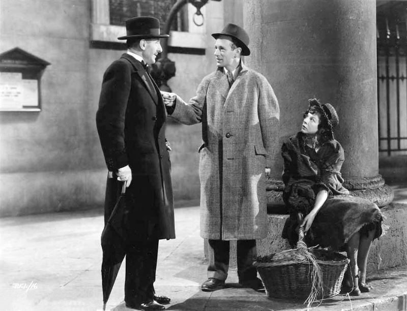 1930s men's fashion in a 1939 still of Scott Sunderland, Leslie Howard, and Wendy Hiller in Pygmalion.