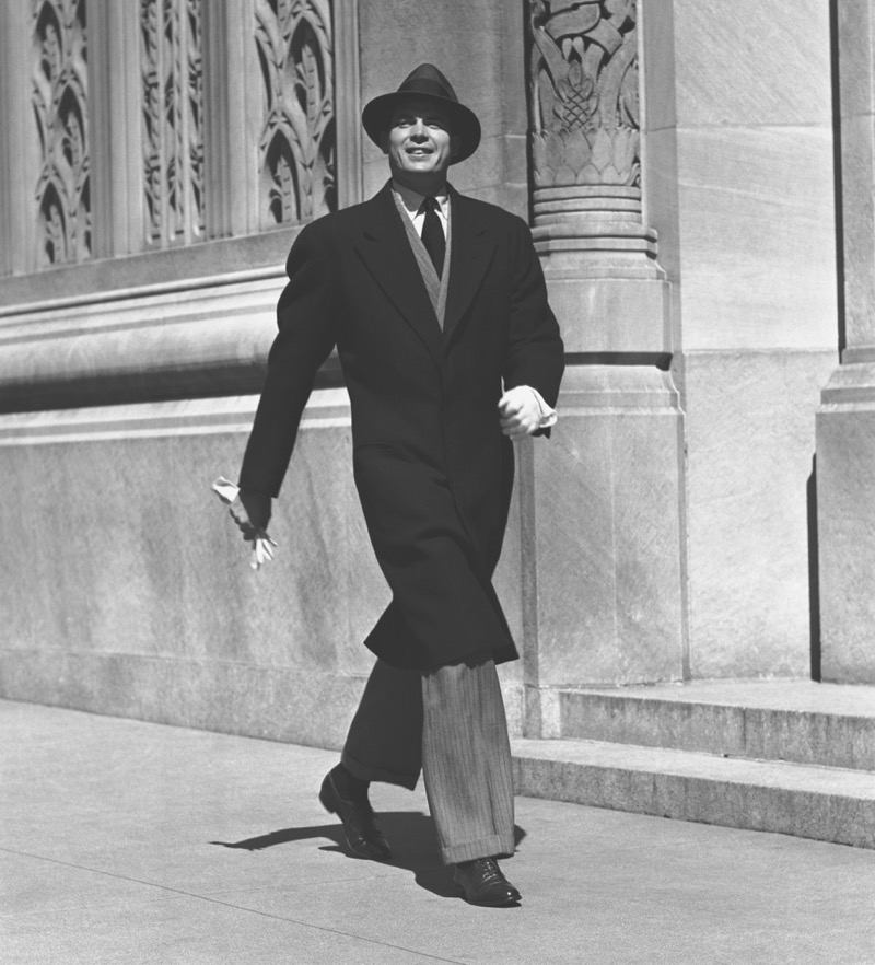A relaxed-cut coat provides a confident outer layer to a 1950s suit.