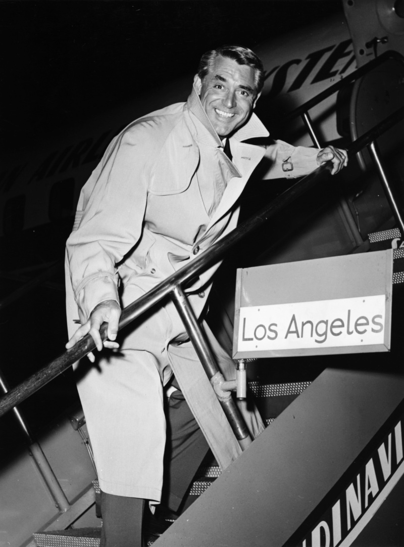 Cary Grant wears a classic trench at Kastrup Airport CPH in 1956.