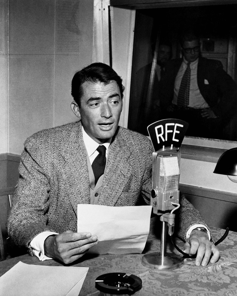 Gregory Peck wears a Harris Tweed sport coat for a 1953 edition of Radio Free Europe.