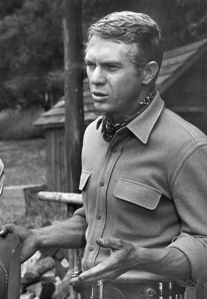 Steve McQueen wears a fitted shirt with chest pockets as Josh Randall in a 1959 episode of Wanted: Dead or Alive.