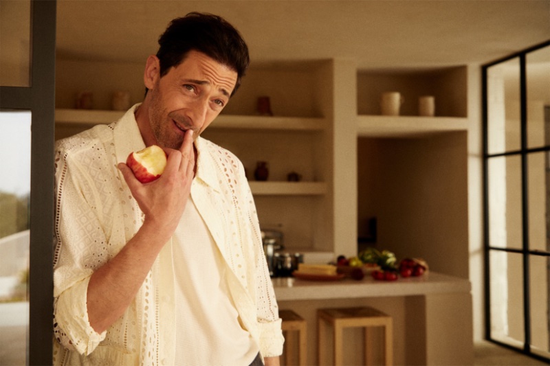 A summer vision, Adrien Brody dons a eyelet shirt for Kith's latest campaign. 