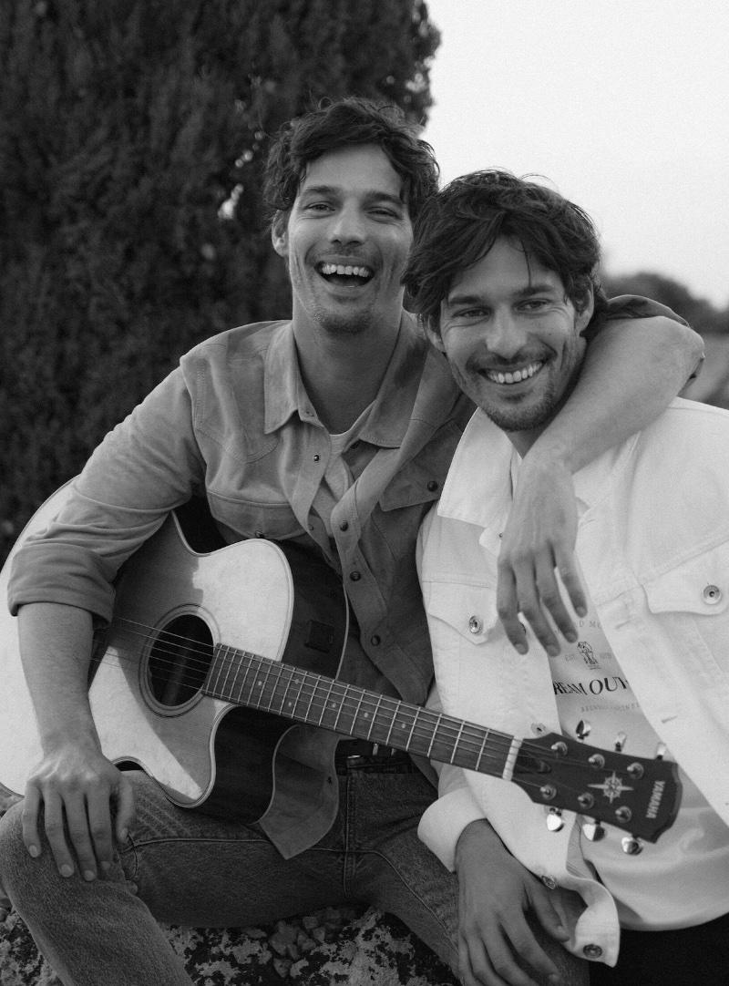 Brothers Edu and Jorge Roman appear in a black-and-white photo for Brunello Cucinelli's knit runners story. 