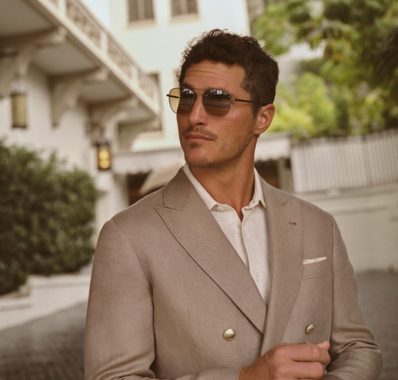 Ollie Edwards models Marsan aviator sunglasses for the Brunello Cucinelli x Oliver Peoples spring-summer 2023 campaign.