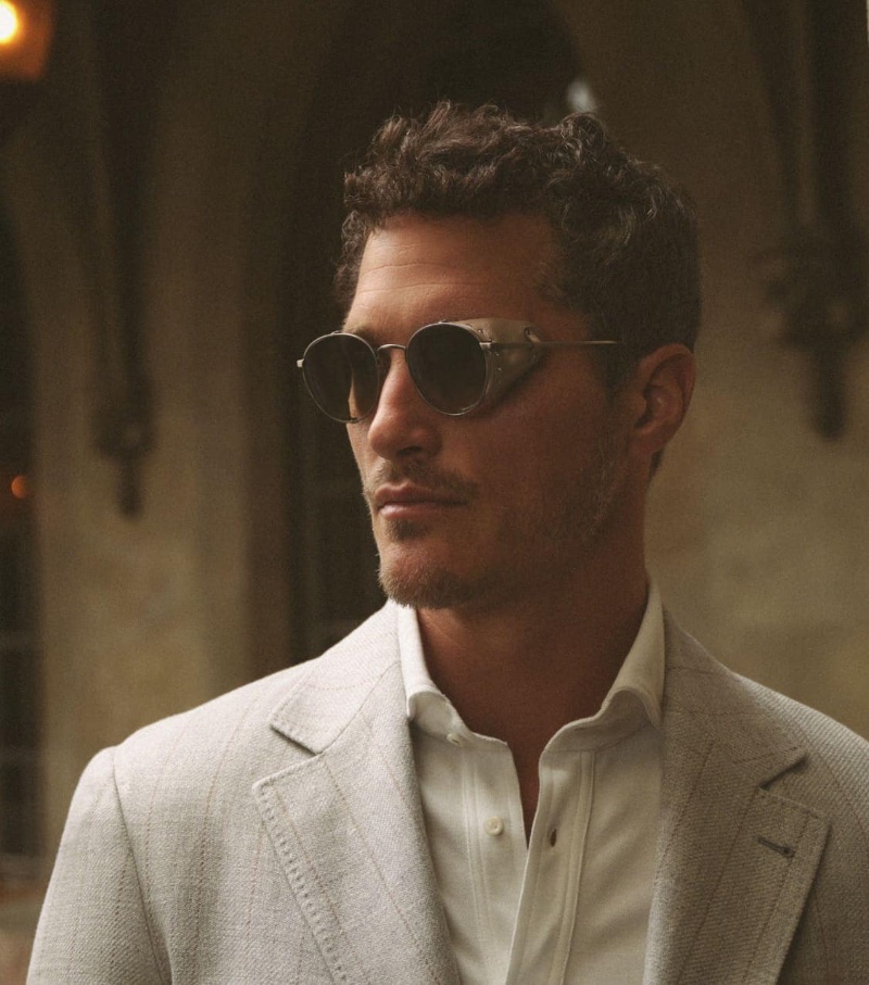 Making a retro statement, Ollie Edwards rocks Cesarino-L sunglasses from the Brunello Cucinelli x Oliver Peoples spring-summer 2023 collection. The sunglasses feature a panto lens shape and leather side shield.