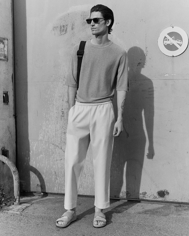 Taking to the streets of Marseille, Justin Eric Martin sports a relaxed t-shirt with elasticated trousers and square-framed sunglasses.