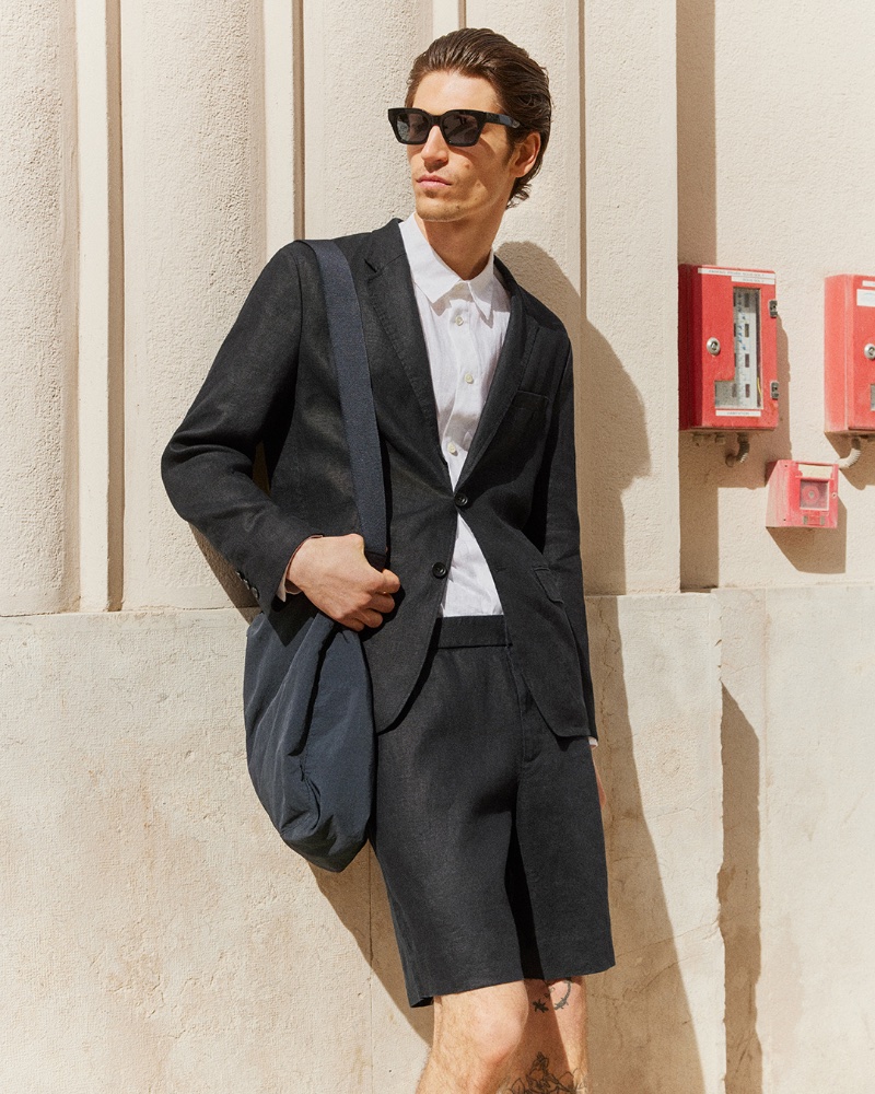 Model Justin Eric Martin wears a short suit with a linen shirt and D-frame sunglasses. » COS Takes to Marseille with Chic Linen Style Model Justin Eric Martin wears a short suit with a linen shirt and D-frame sunglasses.