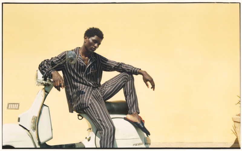 Bah Aziz wears striped silk pajamas from the Dolce & Gabbana x Mytheresa capsule collection. » Dolce & Gabbana x Mytheresa Capsule: A Summer's Day in Palermo Bah Aziz wears striped silk pajamas from the Dolce & Gabbana x Mytheresa capsule collection.