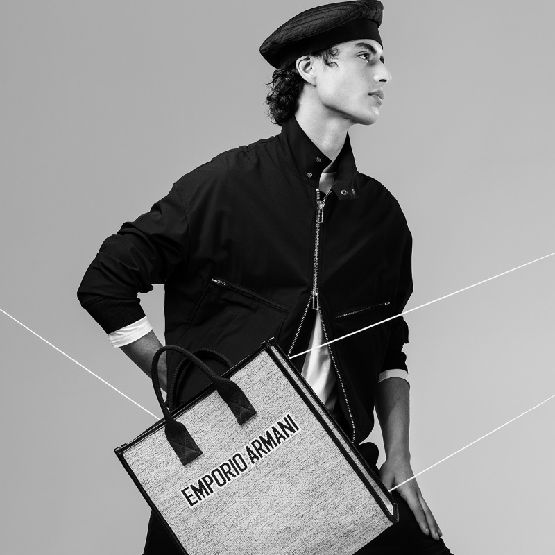 A sporty vision, an image of Yoesry Detre is juxtaposed with one of Emporio Armani's tote bags.