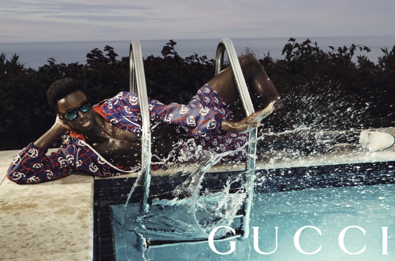 Kevon Adonis Gyamfi relaxes poolside for the Gucci Summer Stories campaign for 2023.