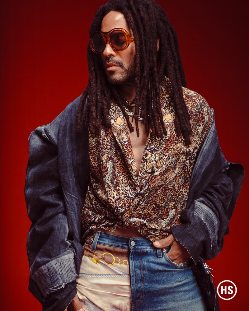 Showcasing his personal style, Lenny Kravitz also sports Gucci jeans with a Diesel jacket.