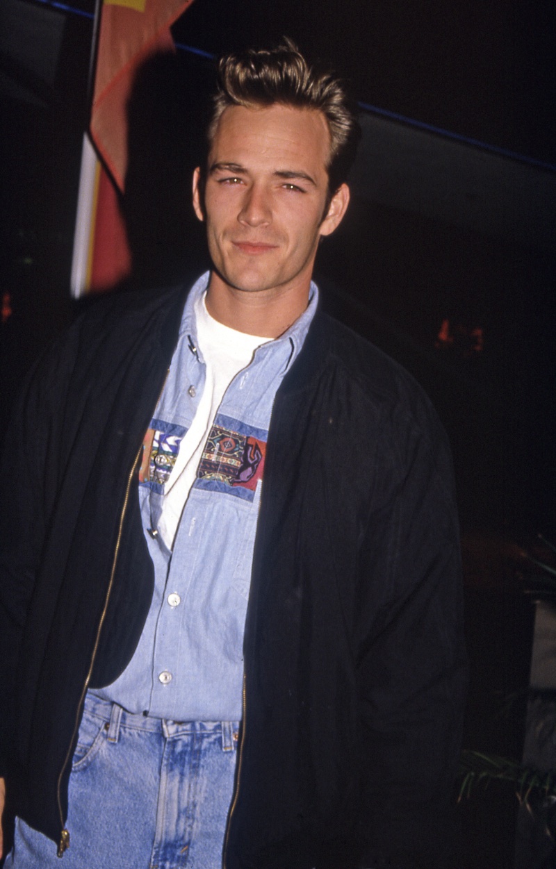 Luke Perry sports a bomber jacket with denim jeans in this picture, circa 1991. 