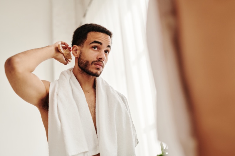 Man Brushing Hair