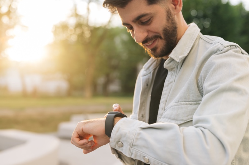 Man Checking Smartwatch Man Checking Smartwatch