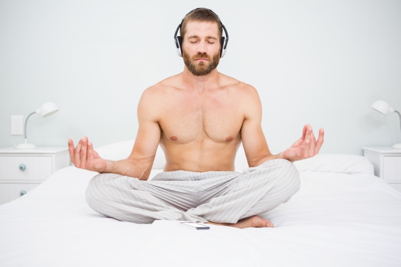 Man Doing Yoga Shirtless Bed Headphones Man Doing Yoga Shirtless Bed Headphones