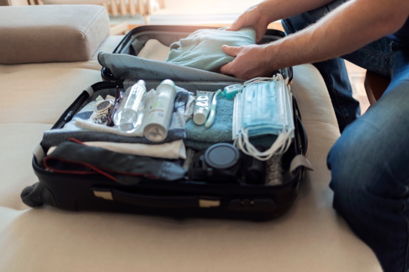 Man Packing Suitcase