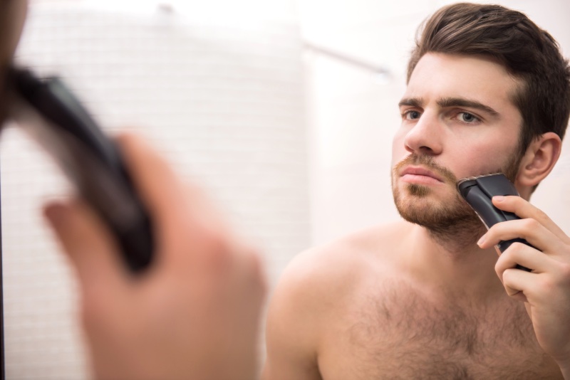 Man Trimming Beard