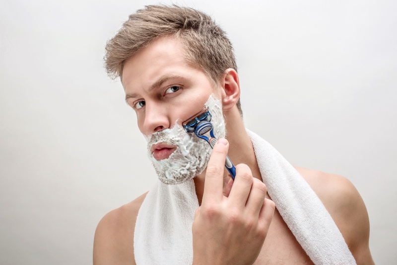 Man Using Razor » Hairstyling Tools for Men: From Locks to Beards Man Using Razor