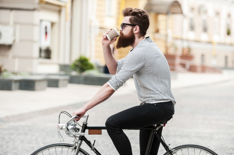 Man on Bike Drinking Coffee