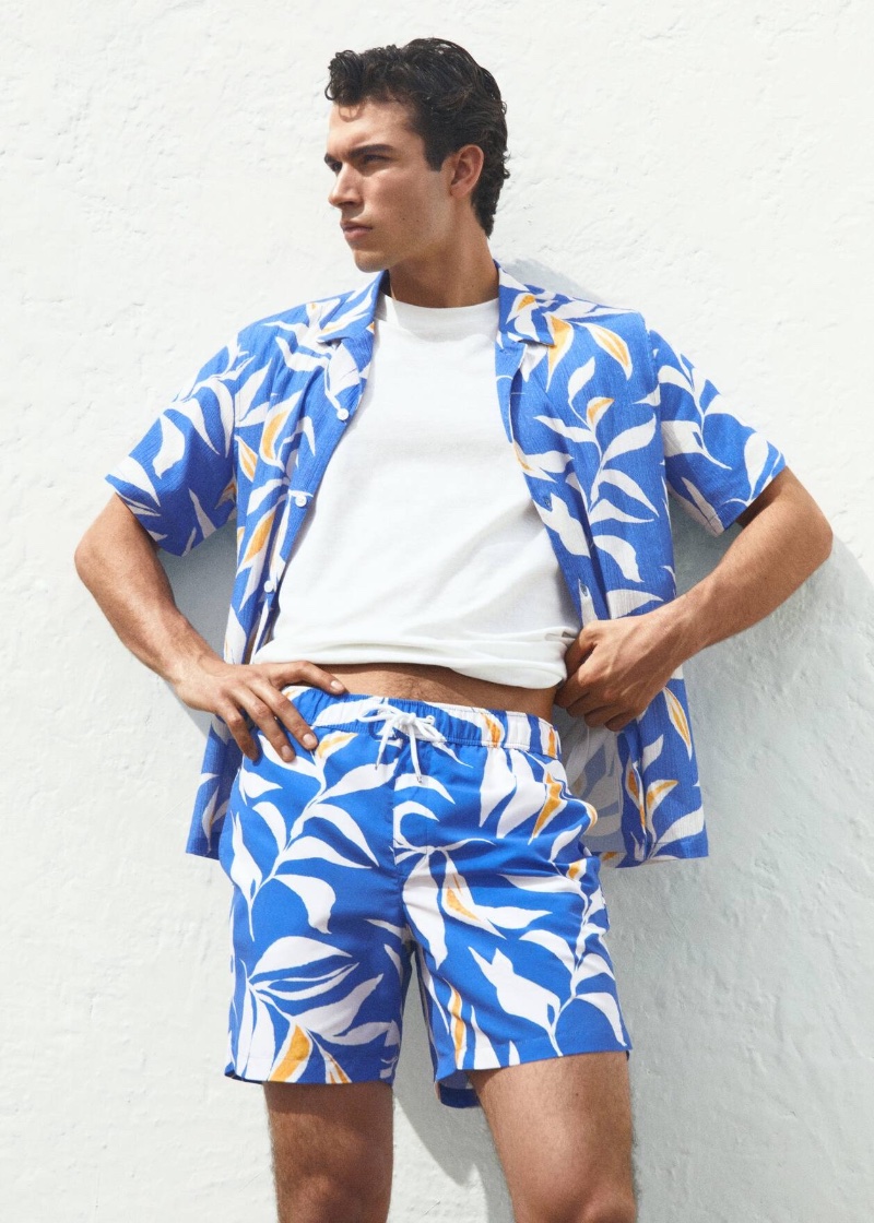 Matching is in vogue as Balthazar Dib sports Mango's Hawaiian print cotton shirt and swimming trunks.