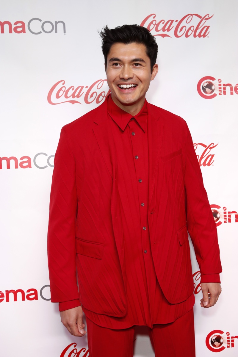 Henry Golding goes bold in a red pleated look by Valentino for the CinemaCon Big Screen Achievement Awards.