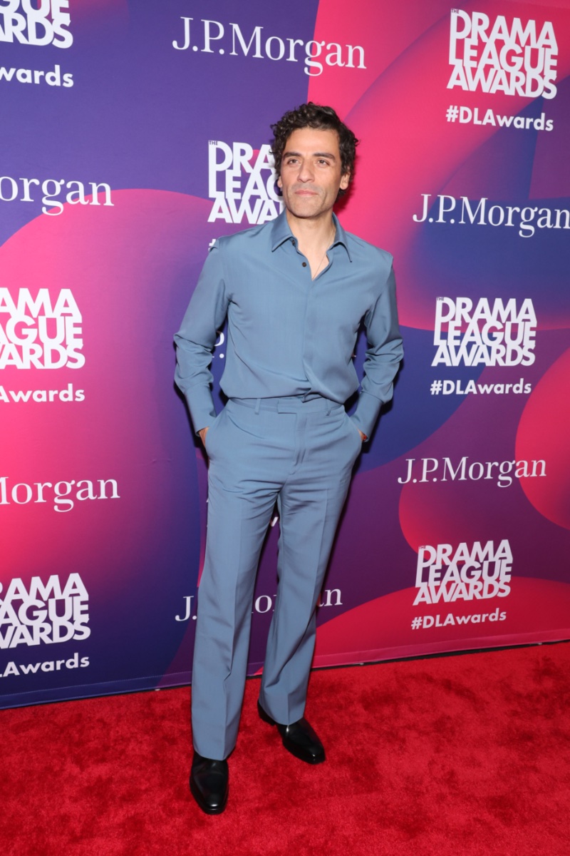 Oscar Isaac wears monochrome style as he attends The Drama League Awards in New York City. Isaac dons a denim blue wool button-down shirt with suit trousers from Ferragamo's pre-fall 2023 collection.