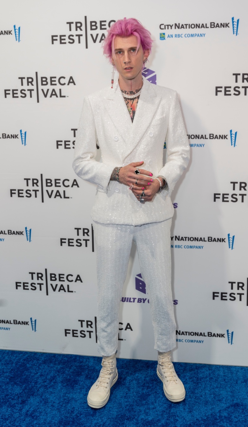 Stepping out in formal wear, Machine Gun Kelly makes a sartorial splash in a white double-breasted suit by Dolce & Gabbana. Attending the New York premiere of Taurus, MGK accessorized with pearls and high tops. Meanwhile his pink hair added a nice contrast. » Monochromatic Outfits for Men: Mastering Monochrome Stepping out in formal wear, Machine Gun Kelly makes a sartorial splash in a white double-breasted suit by Dolce & Gabbana. Attending the New York premiere of Taurus, MGK accessorized with pearls and high tops. Meanwhile his pink hair added a nice contrast.