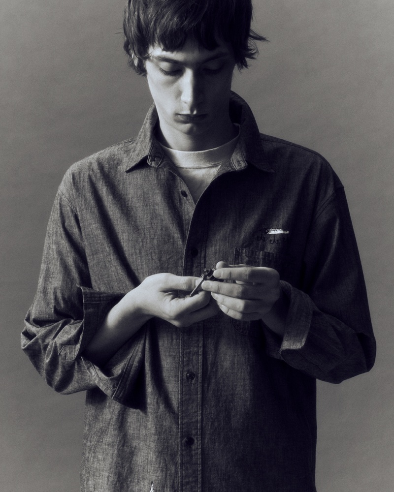 Appearing in a black-and-white photo, Bunny Syxes wears a PS Paul Smith Red Ear cotton chambray "Fish" shirt.