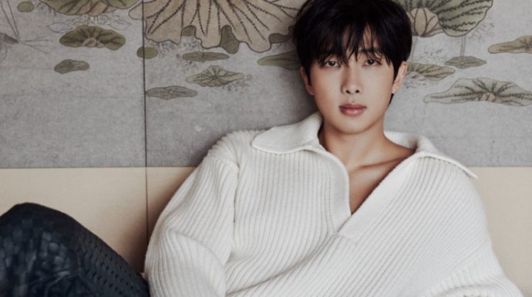 RM covers Vogue Korea, wearing a Bottega Veneta v-neck polo sweater with leather trousers.