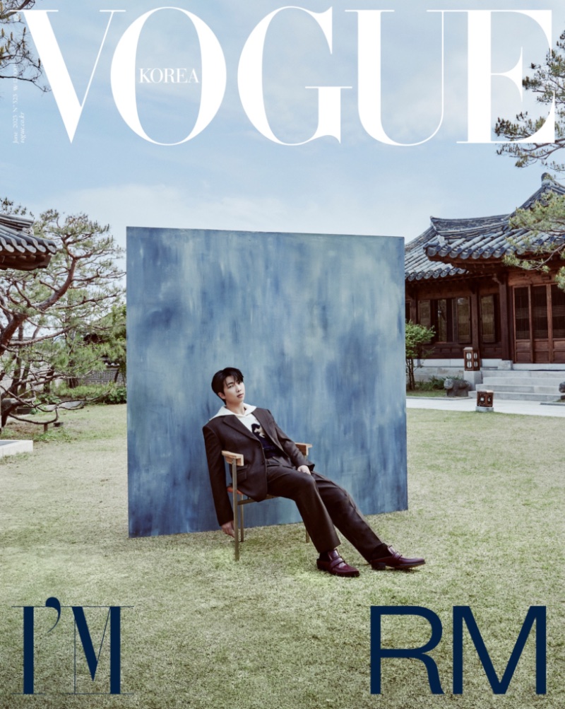 BTS member RM sits for a portrait, donning a Bottega Veneta suit for the June 2023 cover of Vogue Korea.
