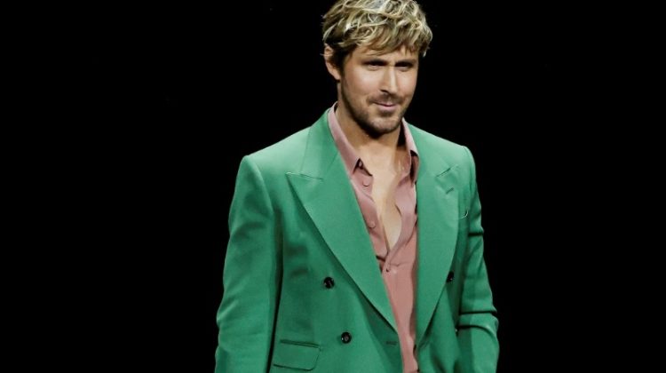 Actor Ryan Gosling makes a bold statement in a green suit and pastel pink shirt at a Universal Pictures and Focus Features special presentation at The Colosseum during CinemaCon.
