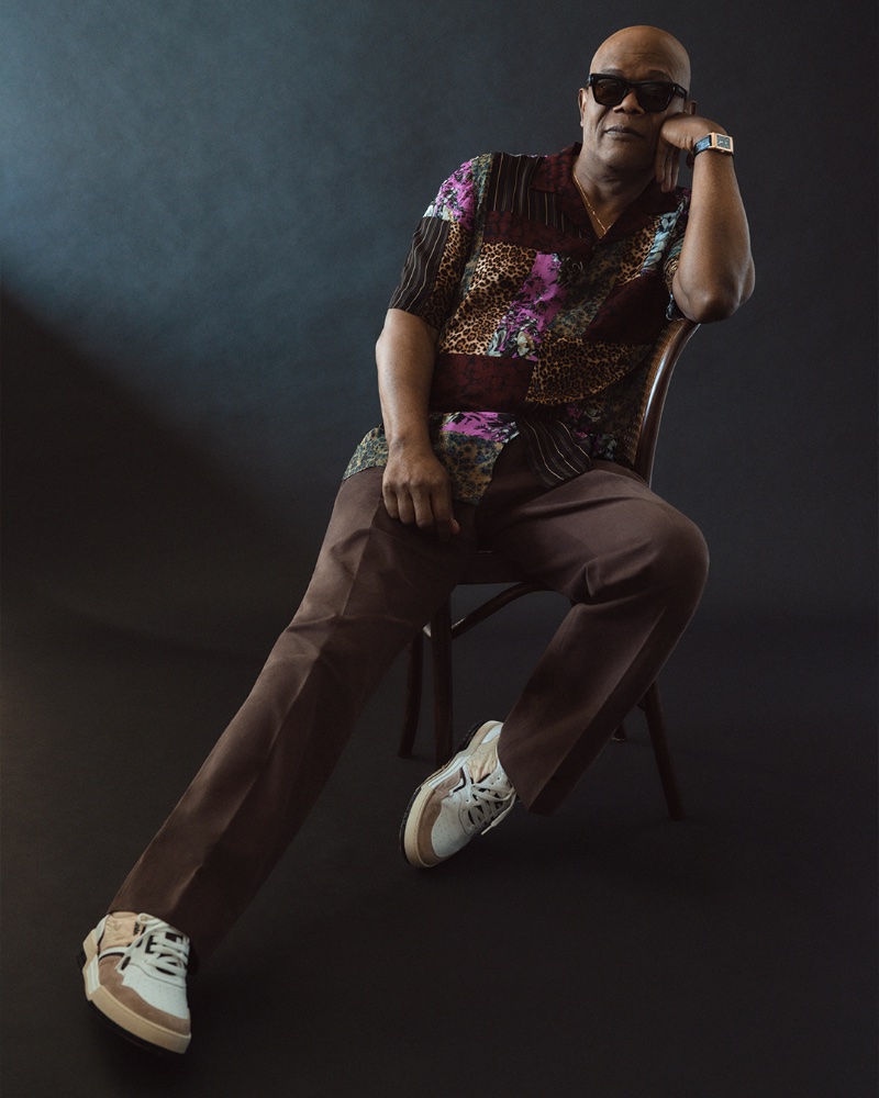Actor Samuel L. Jackson wears a Dries Van Noten crepe shirt with Stòffa drawstring trousers, Jacques Marie Mage sunglasses, an Anita Ko necklace, RHUDE sneakers, and a Jaeger-LeCoultre watch.