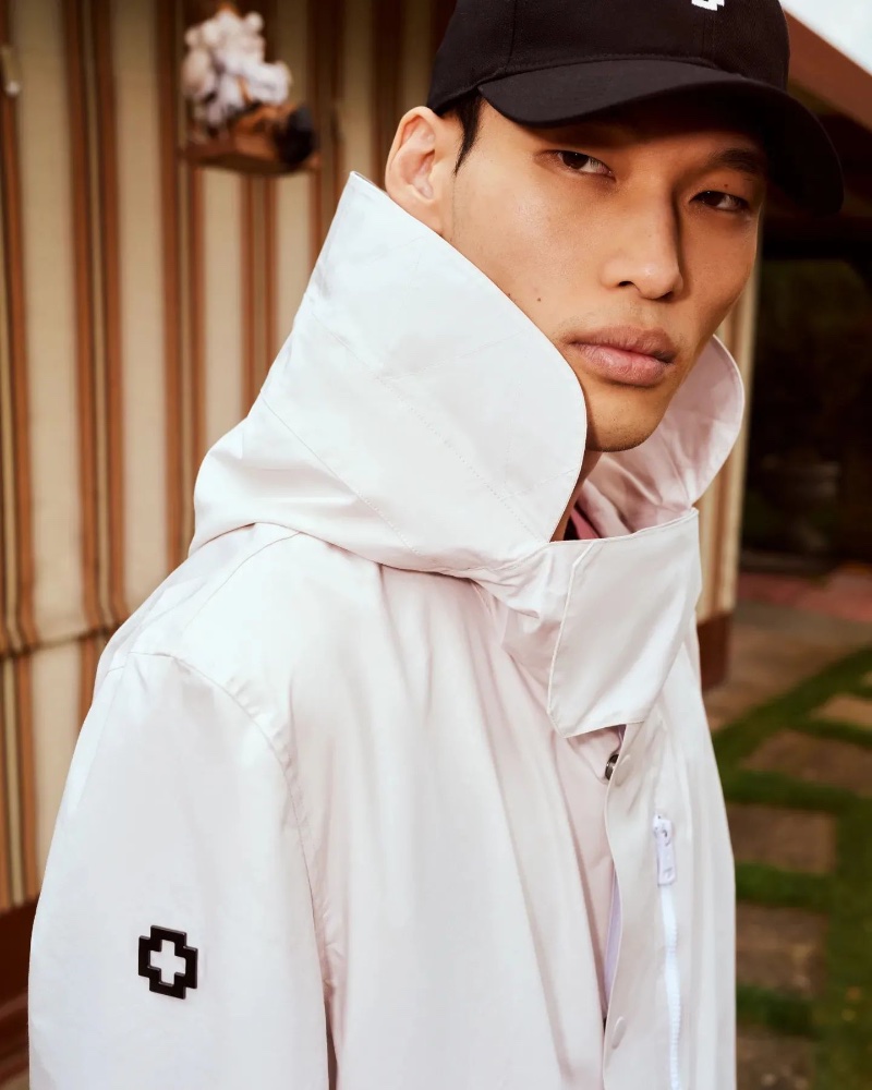Chun Soot goes sporty in a white jacket for Strellson's spring-summer 2023 campaign. 