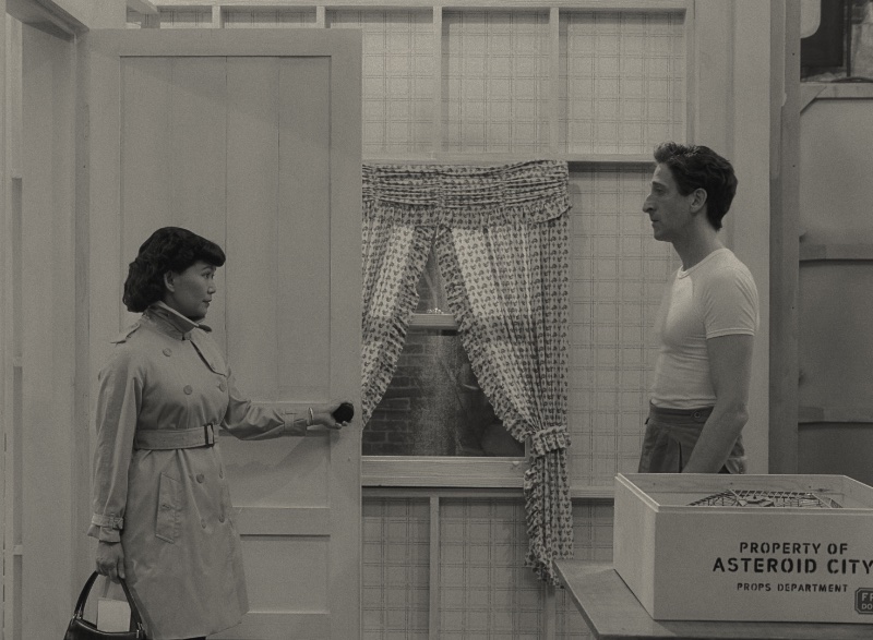 Hong Chau as Polly and Adrien Brody as Schubert Green in Wes Anderson's Asteroid City. » Wes Anderson's Asteroid City: Unpacking the Visual Magic Hong Chau as Polly and Adrien Brody as Schubert Green in Wes Anderson's Asteroid City.