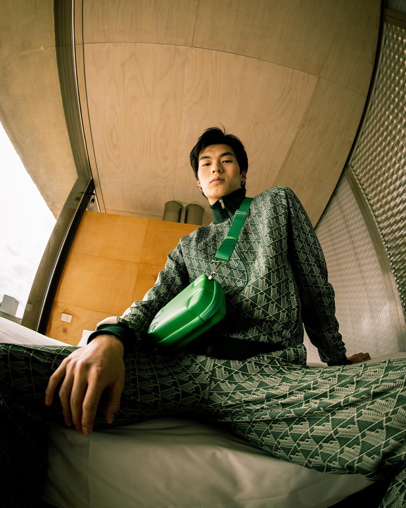 Channeling sporty style, Xiangyu Li rocks a green tracksuit for Wormland's spring-summer 2023 campaign.