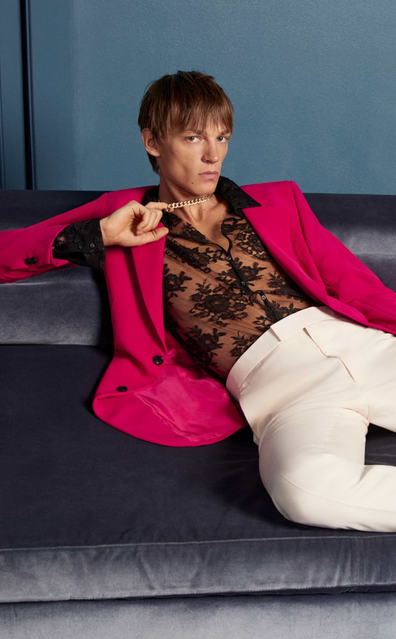 Embracing a bold pop of color in an Emporio Armani blazer $399, Michael Zieliński also wears a sheer lace shirt. 