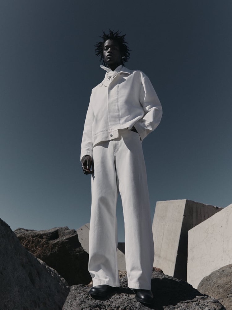 Zakaria Dau models an all-white look from the Zara Edition spring-summer 2023 collection.