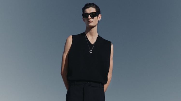 In front and center, Aaron Shandel wears a knit vest with pleated trousers from the Zara Edition spring-summer 2023 collection.
