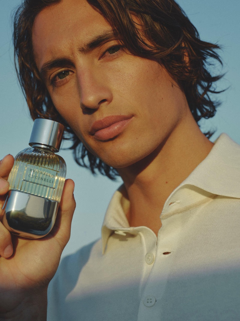 Model James Turlington holds a bottle of Brunello Cucinelli pour homme for the new campaign. 