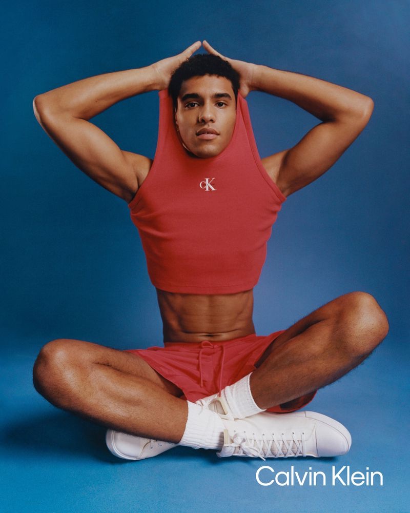 Wearing red, Jan Anthonio makes a splash in the Calvin Klein CK Pride 2023 campaign.