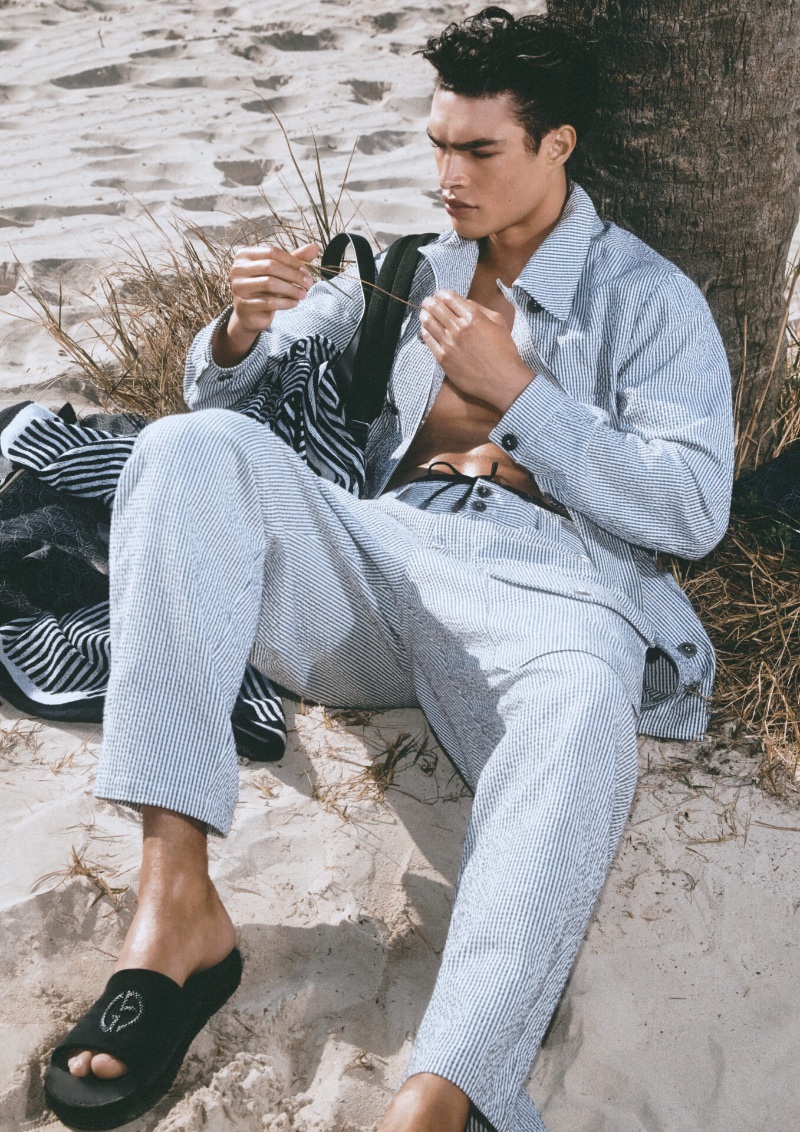 Taking to the beach, Noah Luis Brown wears a striped ensemble for the Giorgio Armani Mare spring-summer 2023 campaign. » Giorgio Armani Mare Summer 2023: Relaxed Elegance Taking to the beach, Noah Luis Brown wears a striped ensemble for the Giorgio Armani Mare spring-summer 2023 campaign.