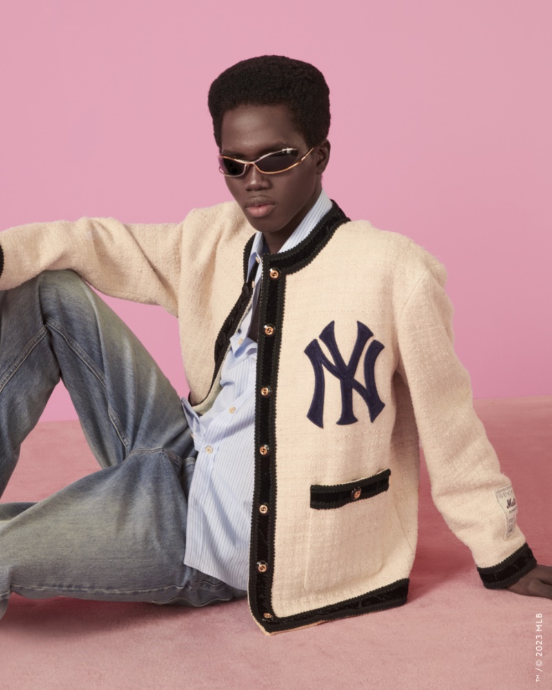 Lawal Badmus wears a retro tweed jacket with the New York Yankees logo from the Gucci MLB capsule collection. 