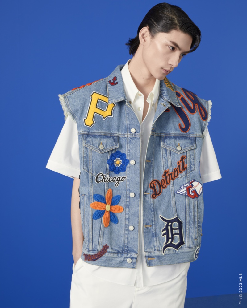 Kin Huang models a denim vest from the Gucci MLB capsule collection.