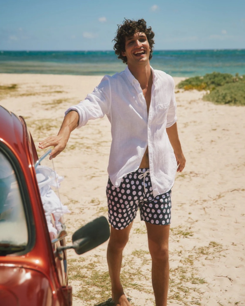 Francisco Henriques makes a splash in J.Crew's 6" polka dot print stretch swim trunks $89.50. 