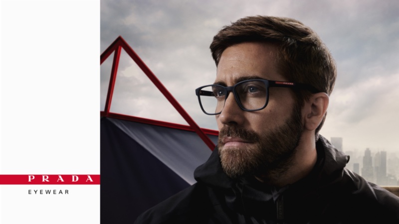 Jake Gyllenhaal wears Prada Linea Rossa's PS 06PV black-framed glasses for the brand's spring-summer 2023 eyewear campaign.