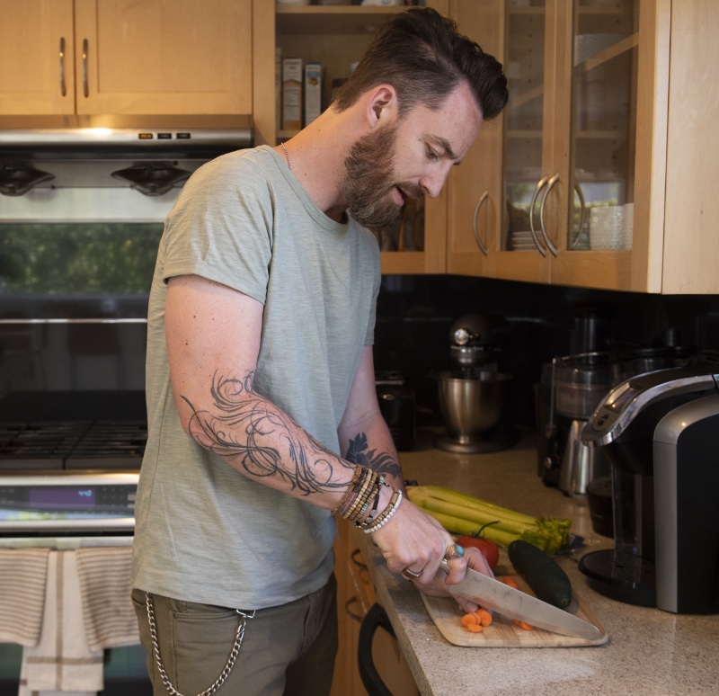 Man Cutting Vegetables Cooking