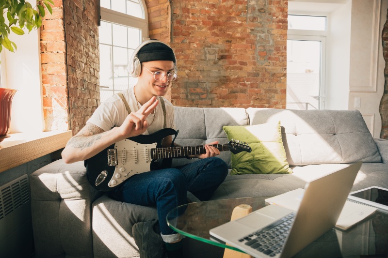 Man Playing Guitar Home Couch