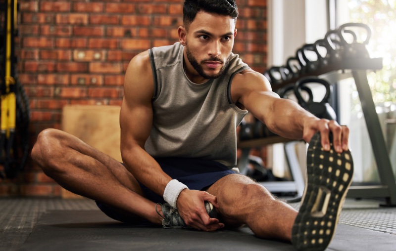 Man Stretching Gym Man Stretching Gym