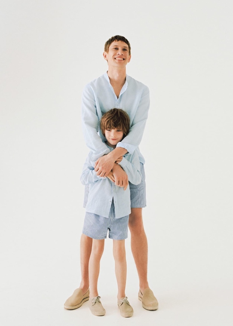 All smiles, Mathias Lauridsen and his son embrace shades of blue in Mango.