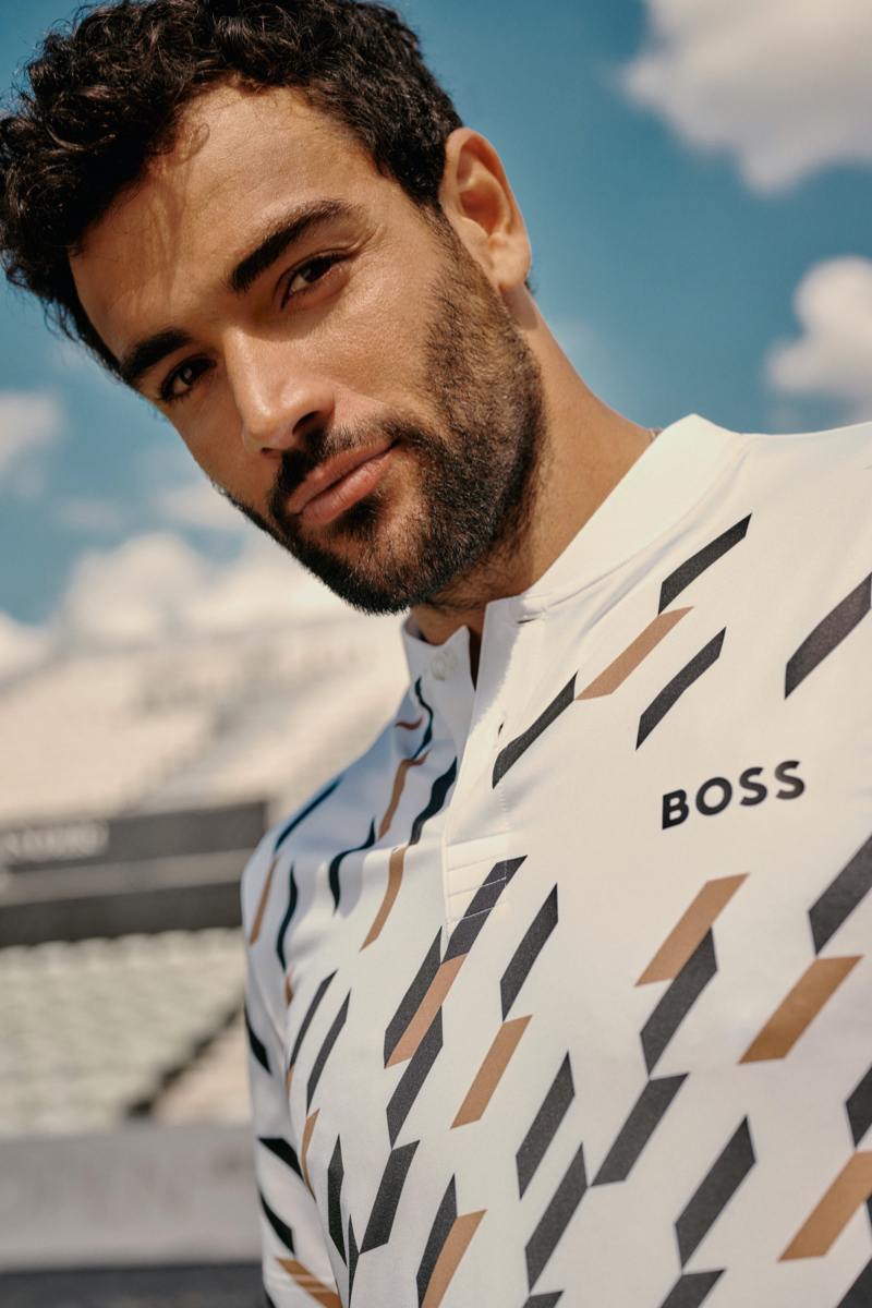 Embracing BOSS' iconic colors, Matteo Berrettini wears a houndstooth polo shirt from his capsule collection.